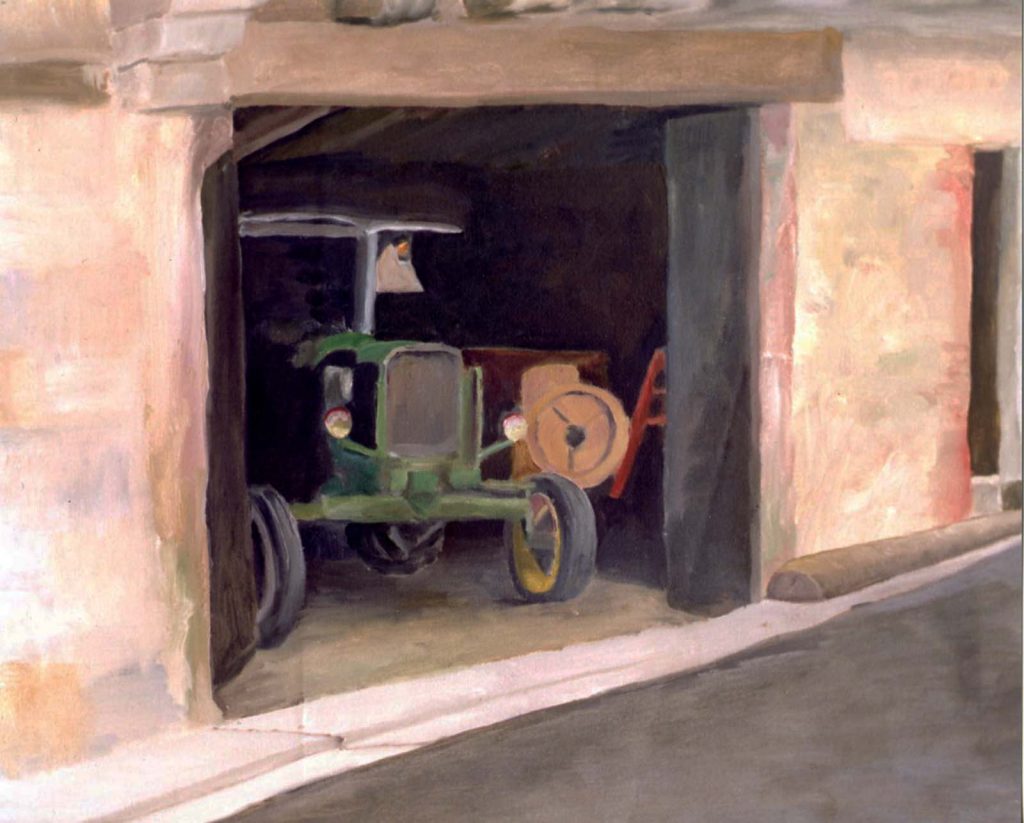 hugh moore tractor in shed in oil