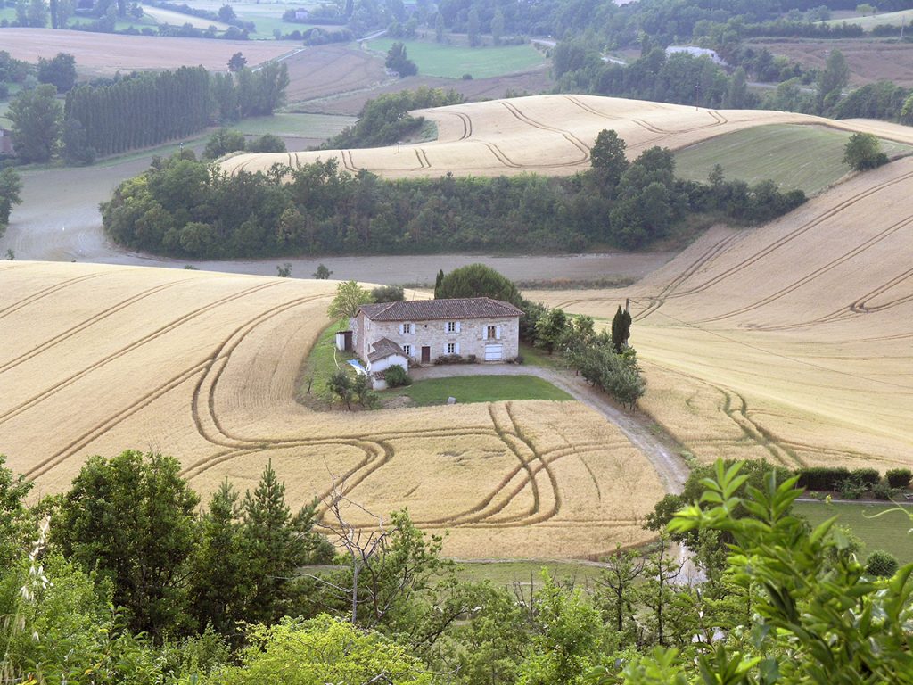 lanscape with house and striped fields